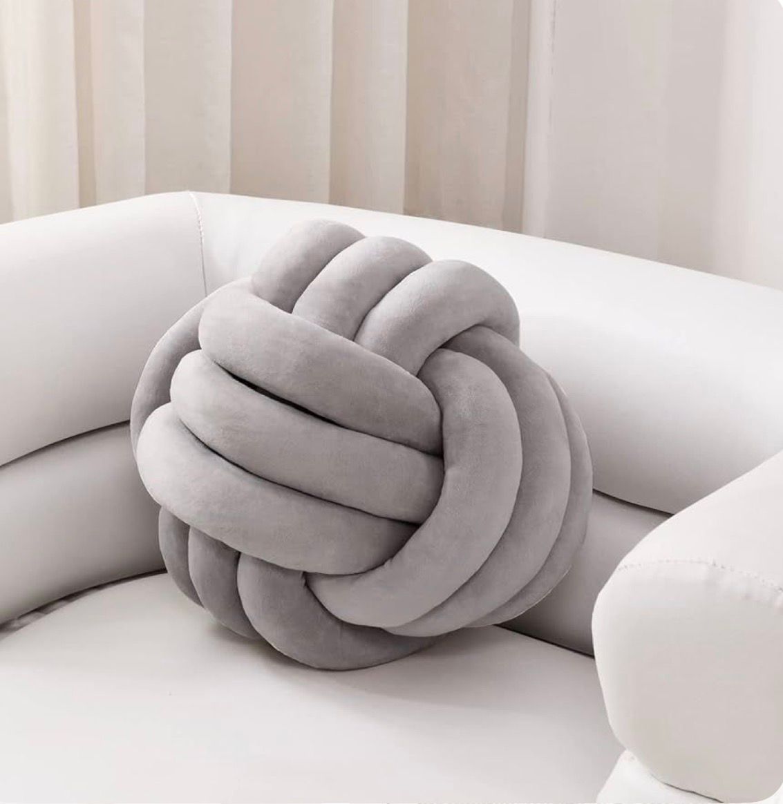 Knot Pillow   The perfect blend of comfort and style. Add a touch of modern luxury to your living space.