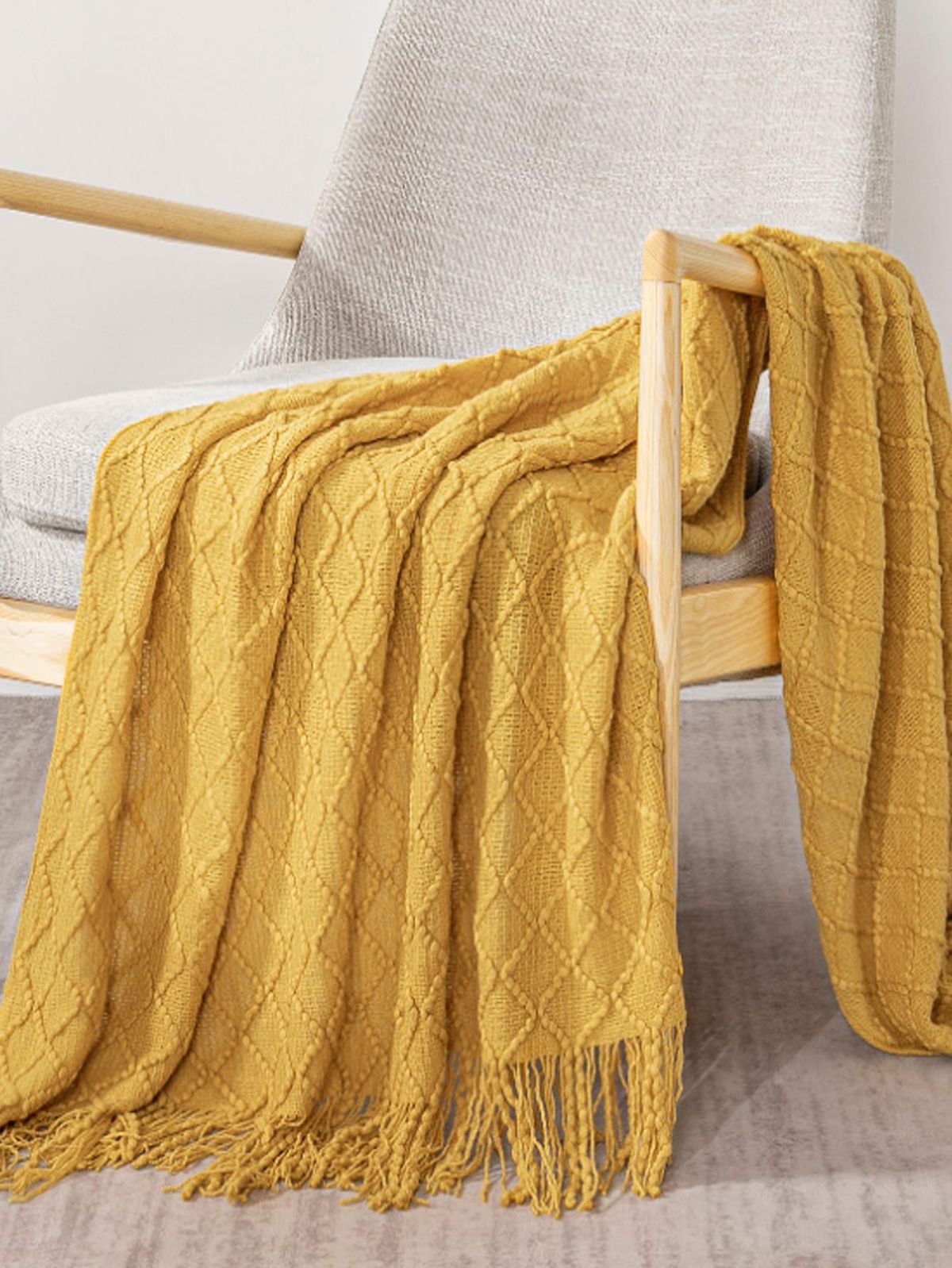 Wrap yourself in the effortless charm of boho luxury. Our throw blankets are more than just cozy layers they’re an expression of artistry and intention. Each piece blends soft, natural textures with timeless design, creating the perfect balance between laid-back comfort and refined elegance. Whether draped across your bed, styled on your sofa, or wrapped around your shoulders on a slow morning, these throws invite warmth, serenity, and a touch of wanderlust into your everyday moments.Colurs available in White, Yellow,Grey,Deep Grey and Coffee Brown