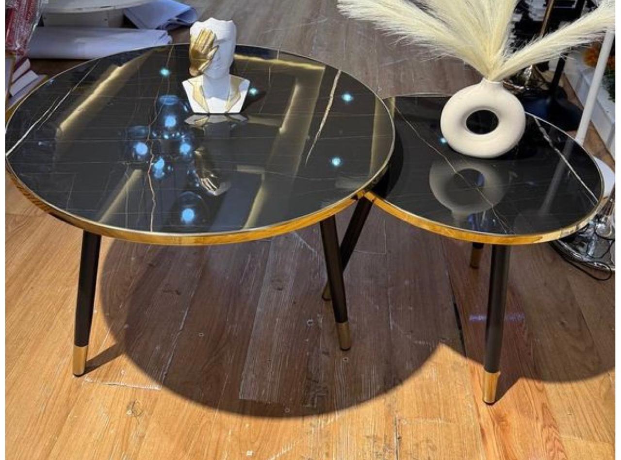 Elevate your living space with our Black & Gold Nesting Coffee Tables. Featuring sleek marble-inspired tops and gold accents, these tables bring a touch of timeless sophistication to any room